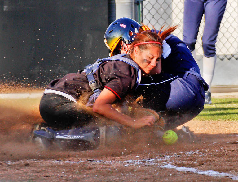 Chaffey catcher Jacqueline Valadez attempts to out a sliding Rio Hondo player at Chaffey on April 9.
