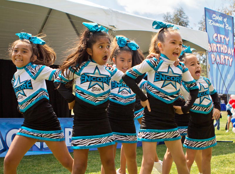 Encore Elite cheerleaders Mia Torres, Bella DeCases, Kayla Perez, Madison Balsz and Chloe Clyborne perform at Pantera Park in Diamond Bar, Calif. on Saturday April 12, 2014.  Their performance was part of the City of Diamond Bar's 25th Anniversary Celebration.